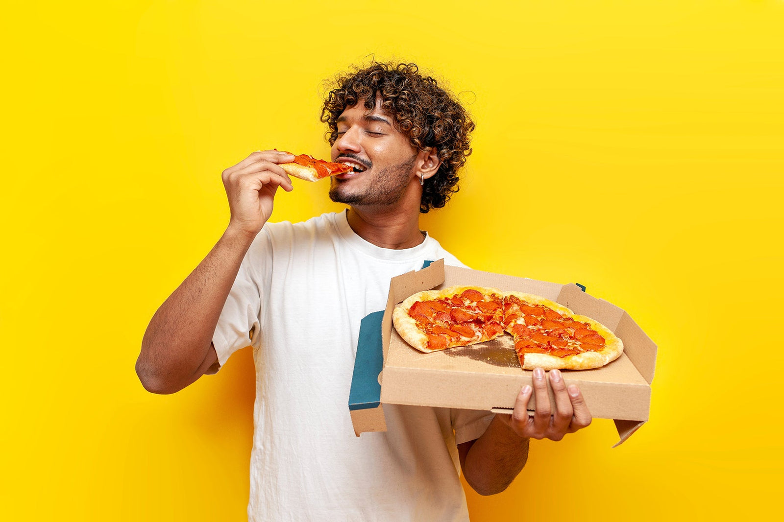 A man eating pizza