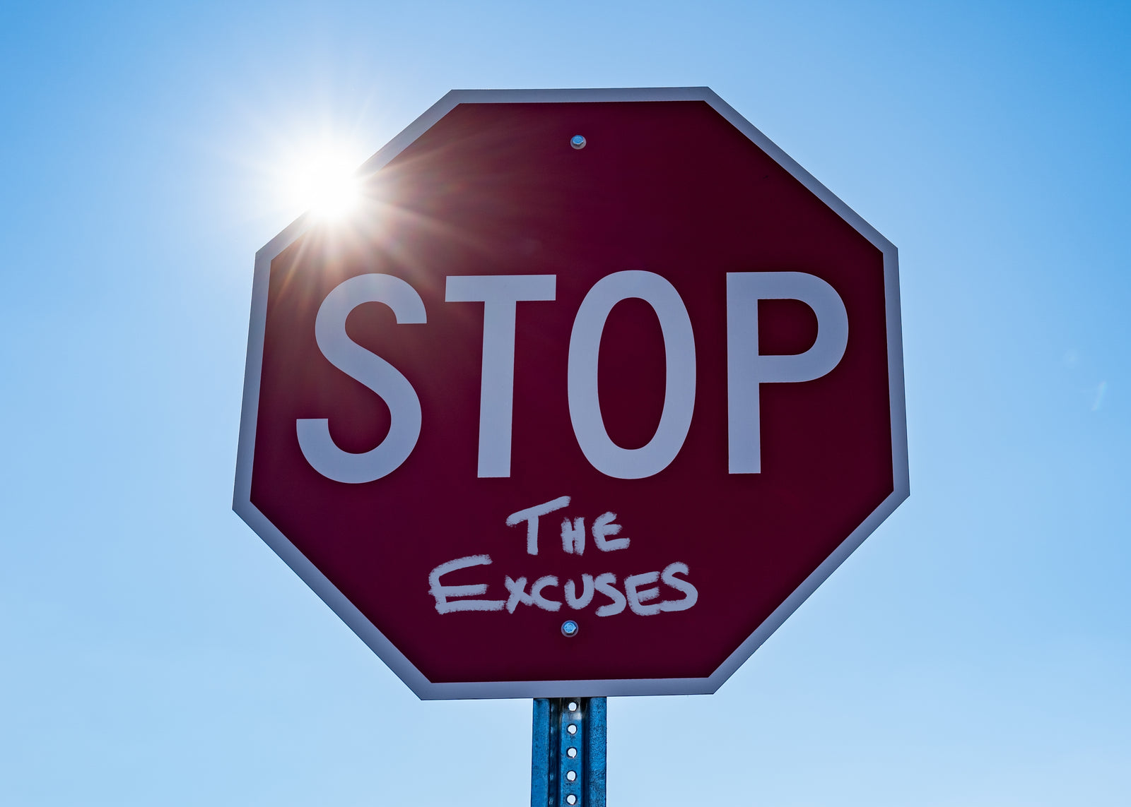 A stop sign with the words the excuses below the word stop